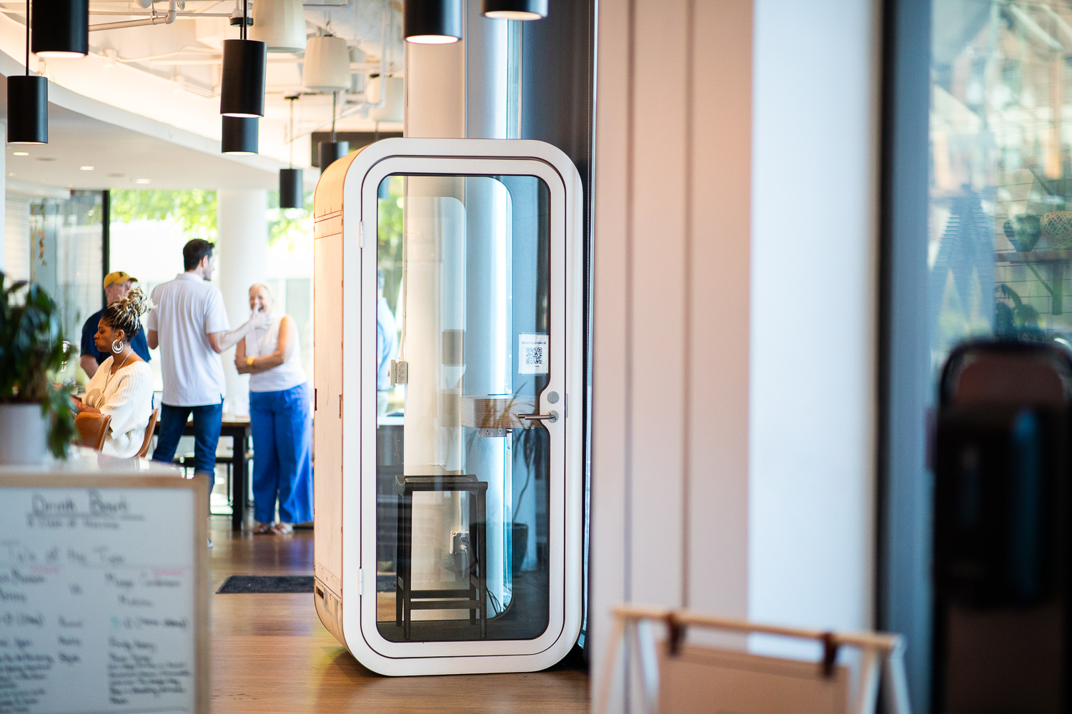 A wide shot of a cafe interior with a Boxed Office unit